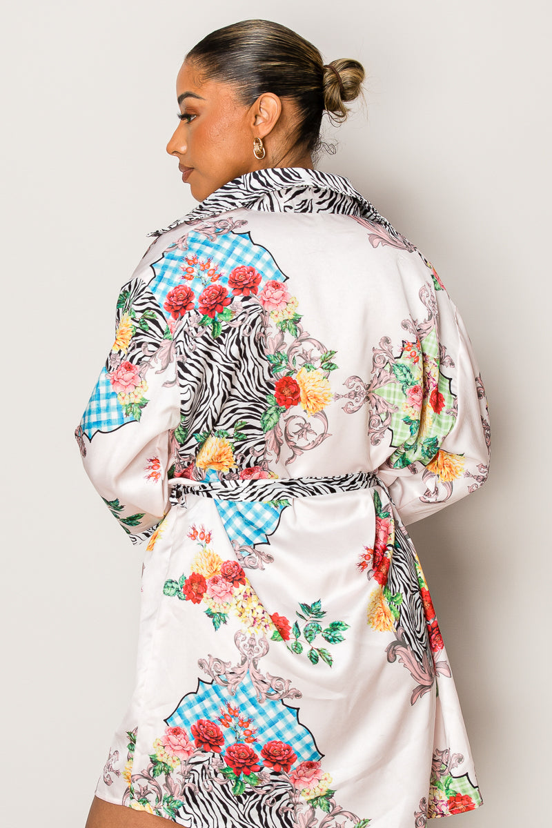 Model in short belted vacation dress with patchwork-style print

