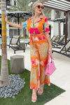 Resort wear jumpsuit styled with a pink handbag