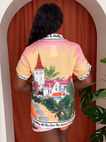 Model wearing two-piece outfit featuring postcard-inspired Grand Canyon motifs.