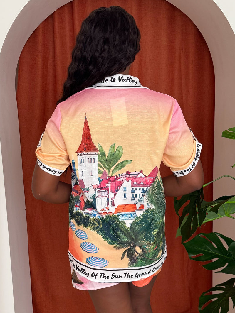Model wearing two-piece outfit featuring postcard-inspired Grand Canyon motifs.