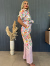 Relaxed fit resortwear with a knotted blouse and printed trousers.