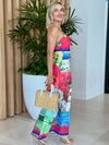 Strapless wide-leg jumpsuit with vibrant travel illustrations.
