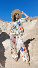 Woman in Endless Moon summer lounge set featuring mermaids and stars