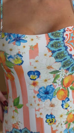 Resort swimwear with orange stripes and Mediterranean print