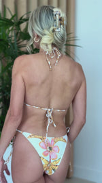 Model wearing Endless Moon tie-side floral bikini