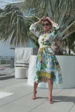 Elegant button-down resort dress with statues and architecture print